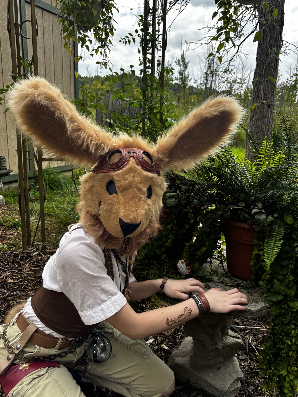 Tan long-eared creature mask being worn outdoors